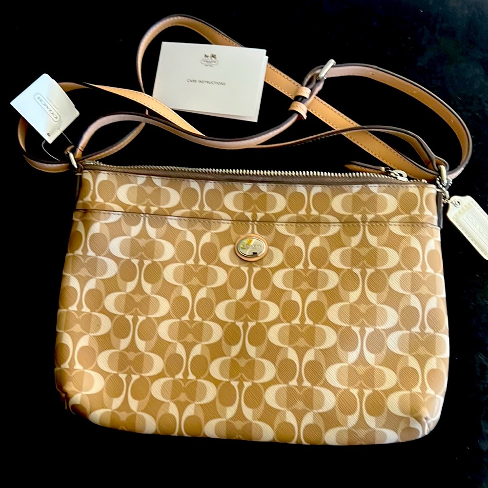 Perfect condition tan bag shoulder strap is adjustable